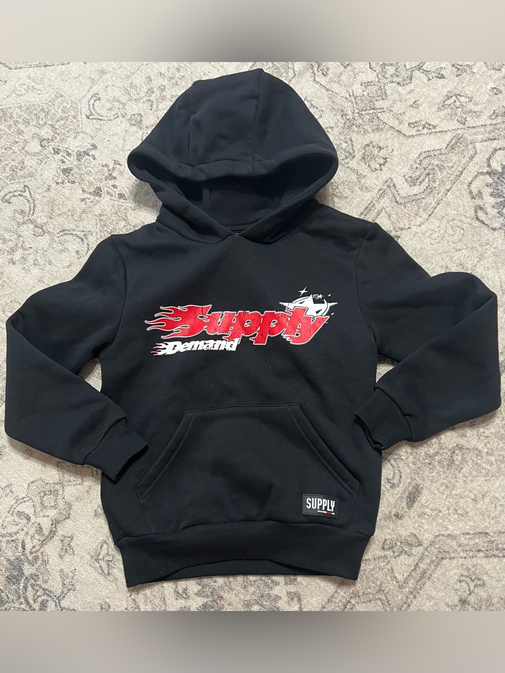 Sonneti Supply & Demand black Martinez pullover hoodie with a red graphic logo